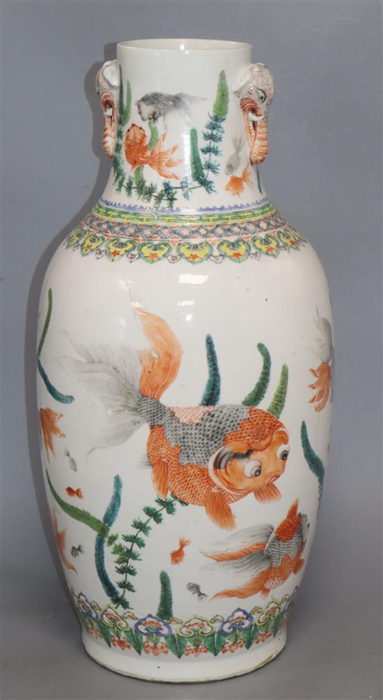 A Chinese famille verte vase, with twin elephant handles and decorated with shubunkins, restored height 22cm